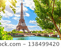 View on the Eiffel Tower from a typical street between the trees of Paris, France 138499420