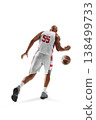 Basketball. Dynamic action shot of a basketball player in motion, running with the ball, rear view. Sport. Isolated on a white 138499733