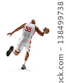 Basketball player on a white background. Basketball player in motion, running with the ball, rear view 138499738