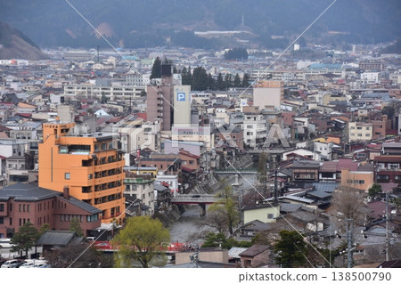 The beautiful townscape of Nakabashi area in the center of Takayama City, Gifu Prefecture, Japan, with cherry blossoms in bud in spring and the Miyagawa River, as seen from Shiroyama Park. The beautiful townscape of Nakabashi area in the center of Takayama City, Gifu Prefecture, Japan, with cherry blossoms in bud in spring and the Miyagawa River, as seen from Shiroyama Park. 138500790