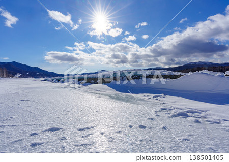 The Taushubetsu River Bridge, buried in snow, is a relic of the former Japanese National Railways in Tokachi, Hokkaido. The Taushubetsu River Bridge, buried in snow, is a relic of the former Japanese National Railways in Tokachi, Hokkaido. 138501405