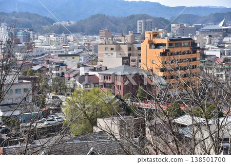 The beautiful townscape of Nakabashi area in the center of Takayama City, Gifu Prefecture, Japan, with cherry blossoms in bud in spring and the Miyagawa River, as seen from Shiroyama Park. The beautiful townscape of Nakabashi area in the center of Takayama City, Gifu Prefecture, Japan, with cherry blossoms in bud in spring and the Miyagawa River, as seen from Shiroyama Park. 138501700