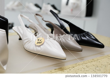 Stylish slingback shoes on display at a modern retail store inviting customers to try them on Stylish slingback shoes on display at a modern retail store inviting customers to try them on 138501770