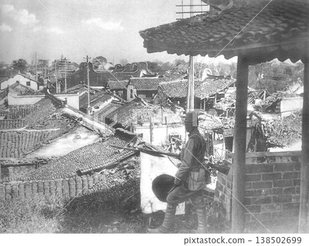 Old photograph, November 13, 1937, during the Second Sino-Japanese War: Japanese Army guards standing on the west gate after the fall of Jiading City in Shanghai. Old photograph, November 13, 1937, during the Second Sino-Japanese War: Japanese Army guards standing on the west gate after the fall of Jiading City in Shanghai. 138502699
