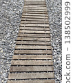 Wooden path over gravel at a beach in summer 138502999