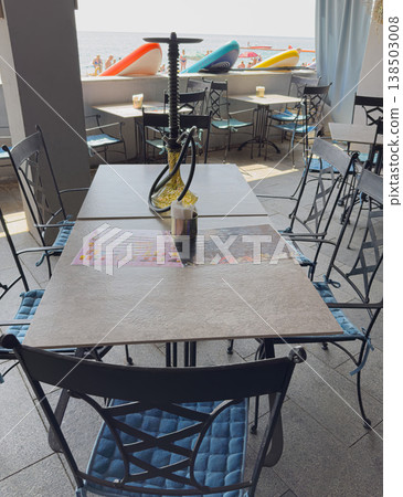 Seating area at a beachside cafe during the day Seating area at a beachside cafe during the day 138503008