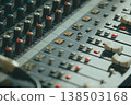Mixing console. Audio mixer. Green tint of light 138503168