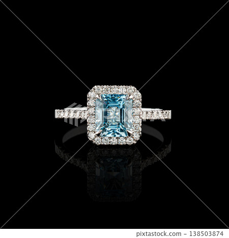Beautiful white gold ring with diamonds and aquamarine on a black background 138503874