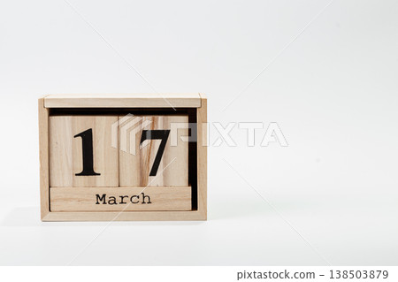 Wooden calendar March 17 on a white background Wooden calendar March 17 on a white background 138503879