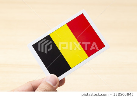 A hand holding a Belgian flag card A hand holding a Belgian flag card 138503945