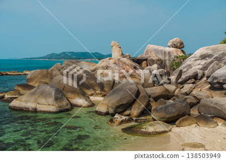 Hin Ta Grandfather Rock coastal formation on Koh Samui with clear turquoise water and smooth granite boulders near Lamai beach Hin Ta Grandfather Rock coastal formation on Koh Samui with clear turquoise water and smooth granite boulders near Lamai beach 138503949