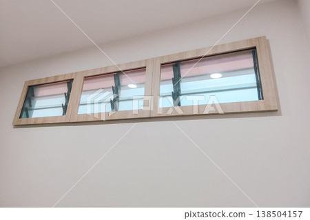 Modern Wooden Frame Window with Natural Light in a Minimalist Interior Modern Wooden Frame Window with Natural Light in a Minimalist Interior 138504157