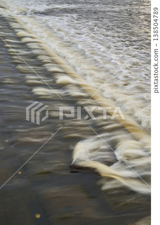 Silky flow over stepped river surface Silky flow over stepped river surface 138504789