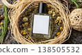 Perfume Bottle Centered Amidst Dried Flowers and Herbs on a Neutral Background 138505532