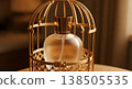 Perfume Bottle Inside Ornate Gold Cage with Soft Focus and Warm Lighting 138505535