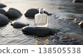 Perfume Bottle Resting On Wet Rock In Flowing Water Reflecting Soft Sunlight 138505538