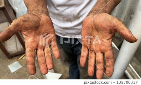 Close up of male dirty hands of adult labor at construction. Repairman rubbing unclean arms after hard work at the site. Concept of exhausting and hard work. Slow motion Close up of male dirty hands of adult labor at construction. Repairman rubbing unclean arms after hard work at the site. Concept of exhausting and hard work. Slow motion 138506317