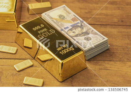 Gold Bars and Stack of Dollar Bills: Premium Financial Wealth and Investment Assets Displayed on Wooden Surface Gold Bars and Stack of Dollar Bills: Premium Financial Wealth and Investment Assets Displayed on Wooden Surface 138506745