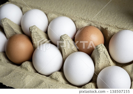 Fresh eggs in the kitchen. Nature background. Chicken egg in carton box for cooking healthy food. Bio organic eggs on the farm. Food concept. Fresh eggs in the kitchen. Nature background. Chicken egg in carton box for cooking healthy food. Bio organic eggs on the farm. Food concept. 138507155