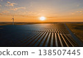 Thousands of Solar Panels Stretching to the Horizon at Dawn 138507445