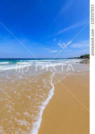 A beautiful summer coastal scene with a blue sky and waves. 138507853