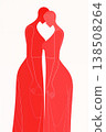 Two women in red dresses are hugging each other 138508264