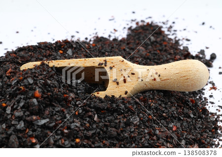Dried Isot Pepper Flakes in a Wooden Ladle Isolated on White Background - Traditional Turkish Chili Dried Isot Pepper Flakes in a Wooden Ladle Isolated on White Background - Traditional Turkish Chili 138508378