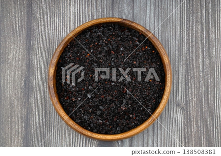 Dried Isot Pepper Flakes in a Wooden Bowl on Dark Wood Background - Traditional Turkish Urfa Chili Dried Isot Pepper Flakes in a Wooden Bowl on Dark Wood Background - Traditional Turkish Urfa Chili 138508381