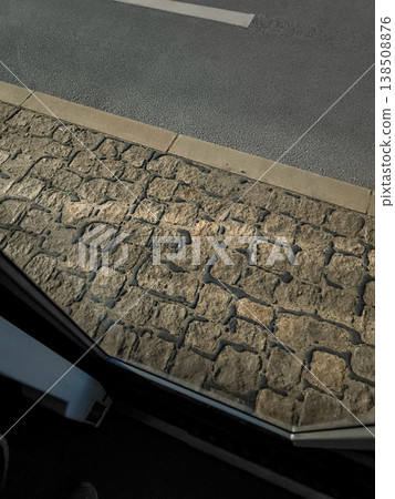Cobblestone sidewalk seen from bus window in prague 138508876