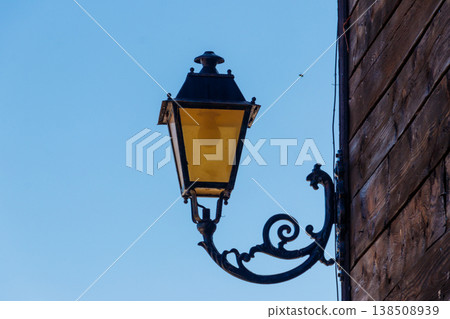 Vintage iron lantern on a house wall Vintage iron lantern on a house wall 138508939