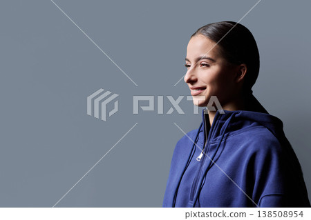 Profile portrait of young smiling teenage girl on gray background Profile portrait of young smiling teenage girl on gray background 138508954
