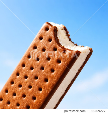 Ice Cream Sandwich Close Up with Bite on Blue Background Ice Cream Sandwich Close Up with Bite on Blue Background 138509227