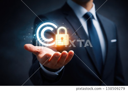 Businessman holding glowing copyright symbol with lock representing intellectual property protection Businessman holding glowing copyright symbol with lock representing intellectual property protection 138509279
