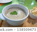Cream of mushroom soup with croutons on a board 138509473