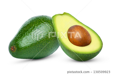 Fresh green avocado and cut in a half of avocado with seed isolated. Fresh green avocado and cut in a half of avocado with seed isolated. 138509923