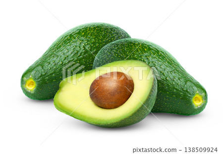 Green fresh avocado with cut in half with seed isolated on white background. Green fresh avocado with cut in half with seed isolated on white background. 138509924