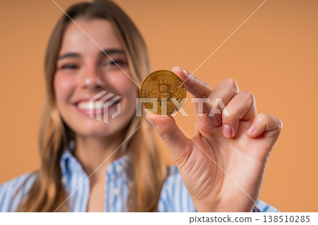 Pretty Woman With Bitcoin, Crypto Currency. Golden Coin On Beige Background. Pretty Woman With Bitcoin, Crypto Currency. Golden Coin On Beige Background. 138510285