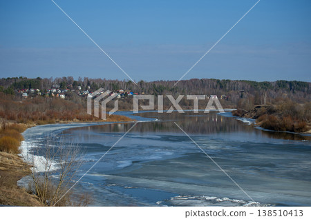 Frozen River Bends Under Blue Sky Frozen River Bends Under Blue Sky 138510413