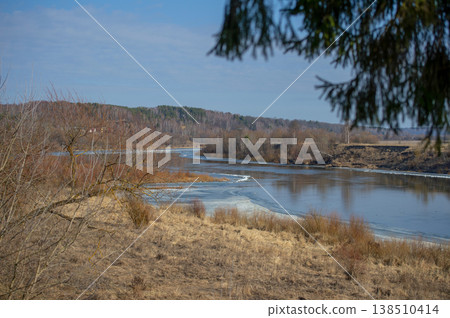 Frozen River Bends Under Blue Sky Frozen River Bends Under Blue Sky 138510414