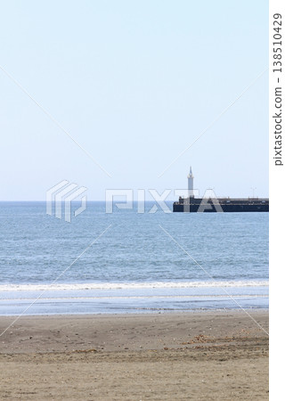 A view of the Enoshima Shonan Port Lighthouse and the horizon of Sagami Bay from Koshigoe Beach. A view of the Enoshima Shonan Port Lighthouse and the horizon of Sagami Bay from Koshigoe Beach. 138510429