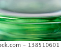 peering into the glass container 138510601