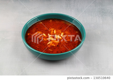 Traditional Turkish Orzo Soup with Tomato Paste and Dried Mint, Warm Homemade Vegetable Broth Base 138510640