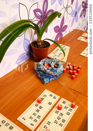 red lotto barrels on game cards and in a pouch on a table red lotto barrels on game cards and in a pouch on a table 138510668