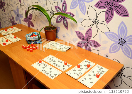 many lotto cards and barrels on a table in a home setting many lotto cards and barrels on a table in a home setting 138510733