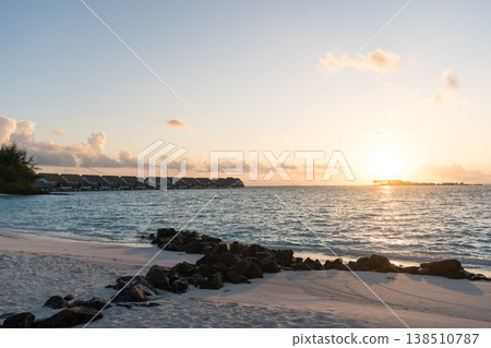 Sunrise on the beach of a hotel in the Maldives Sunrise on the beach of a hotel in the Maldives 138510787