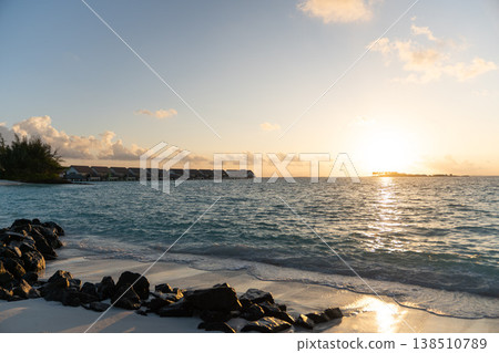 Sunrise on the beach of a hotel in the Maldives Sunrise on the beach of a hotel in the Maldives 138510789