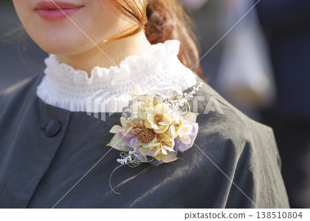 An elegant corsage to adorn your chest at the ceremony. 138510804