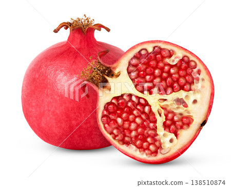 Whole pink pomegranate fruit and cut in a half isolated with clipping path. Whole pink pomegranate fruit and cut in a half isolated with clipping path. 138510874