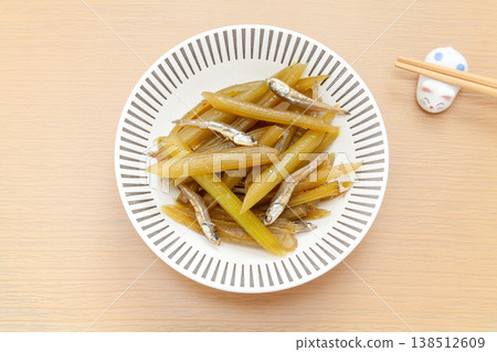 Simmered butterbur with added calcium from dried sardines, a home-style dish. 138512609