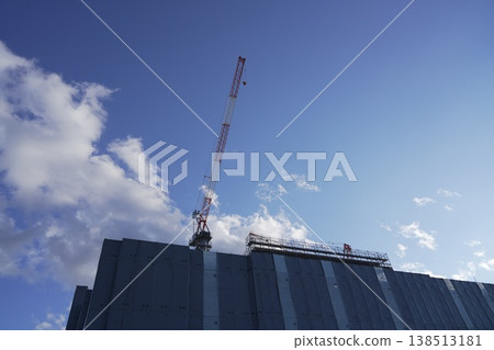 A crane at a construction site and the new building under construction: Taganomori Elementary and Junior High School A crane at a construction site and the new building under construction: Taganomori Elementary and Junior High School 138513181